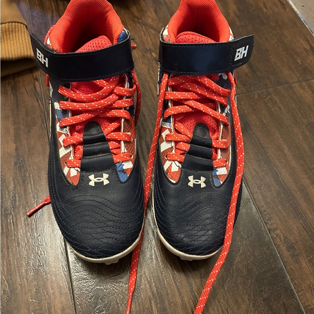 Under Armour blue and red cleats